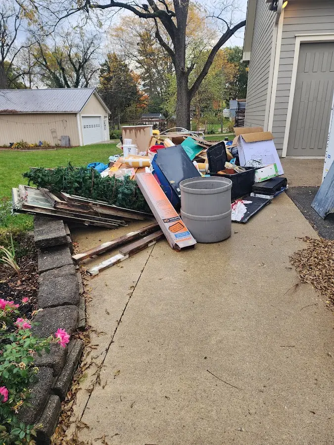 Dumpster being loaded with debris for 3 Yard Dumpster Rental in Sunbury